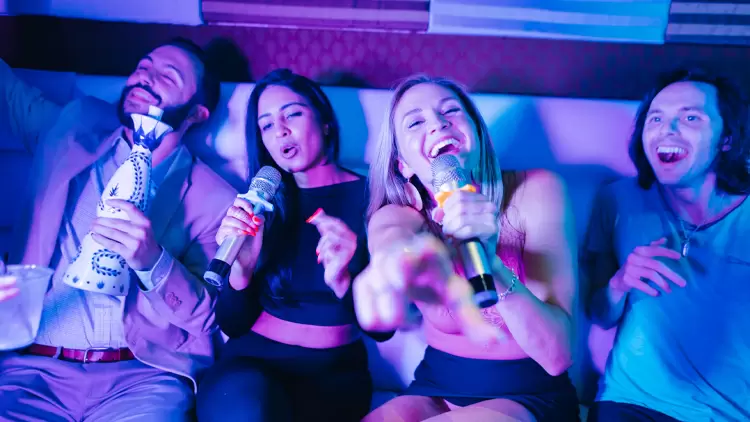 At a friend's party, if someone suggests going to a karaoke bar, but you can't sing well, what would you do?