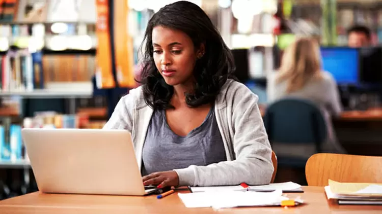 When someone sits next to you in the library while you're studying, how do you respond?